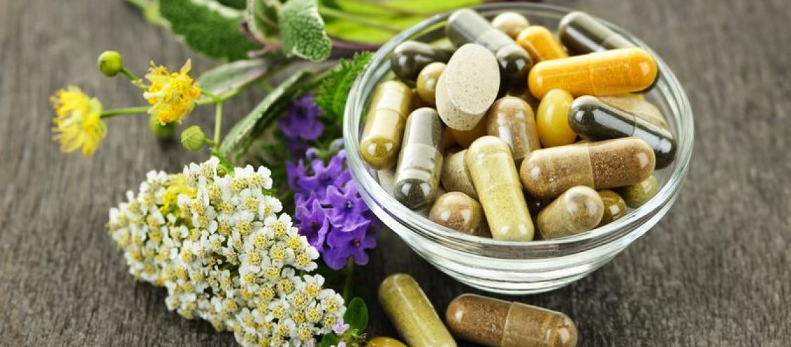 10500918 - herbs with alternative medicine herbal supplements and pills